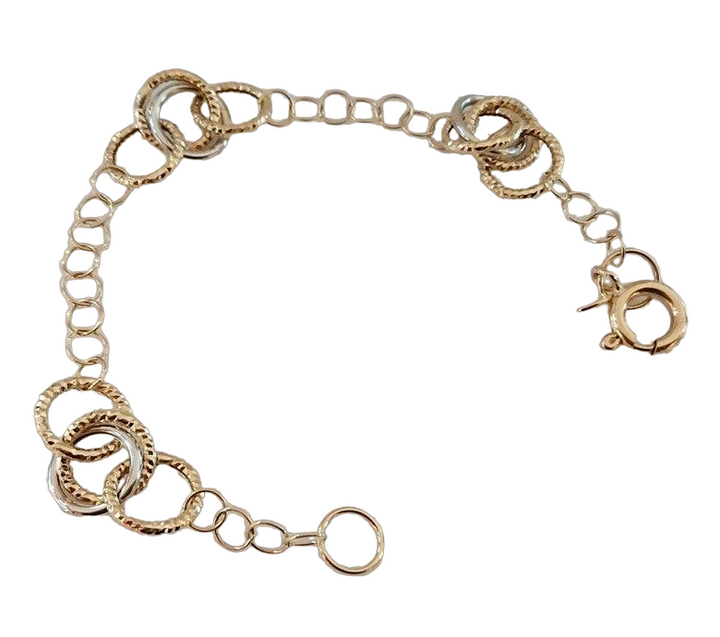 braccilale in oro con anelli bicolore siciliano gioielli 
