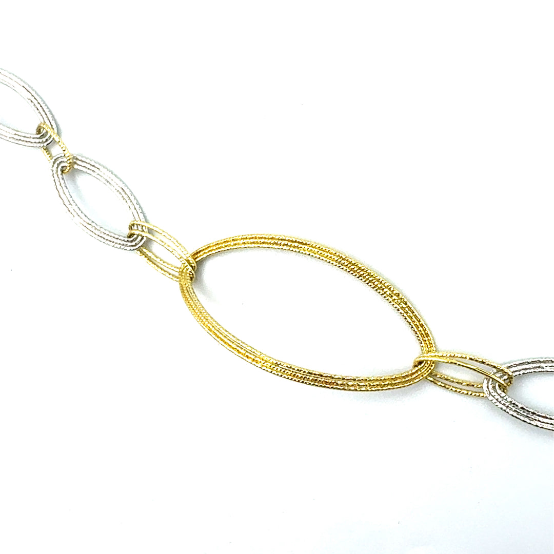 Semi-rigid bracelet in yellow gold