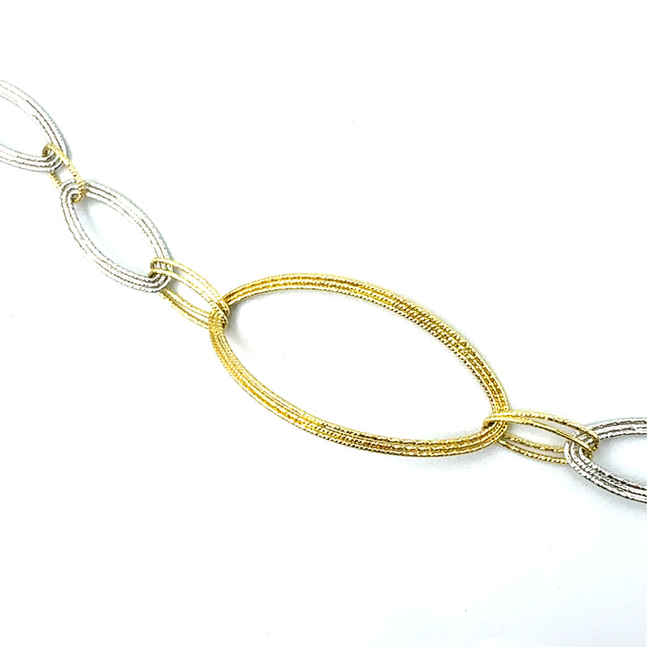 Semi-rigid bracelet in yellow gold
