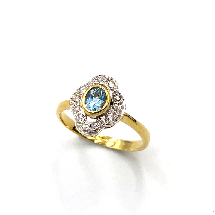 anello oro giallo con zirconi e topazio azzurro siciliano gioielli