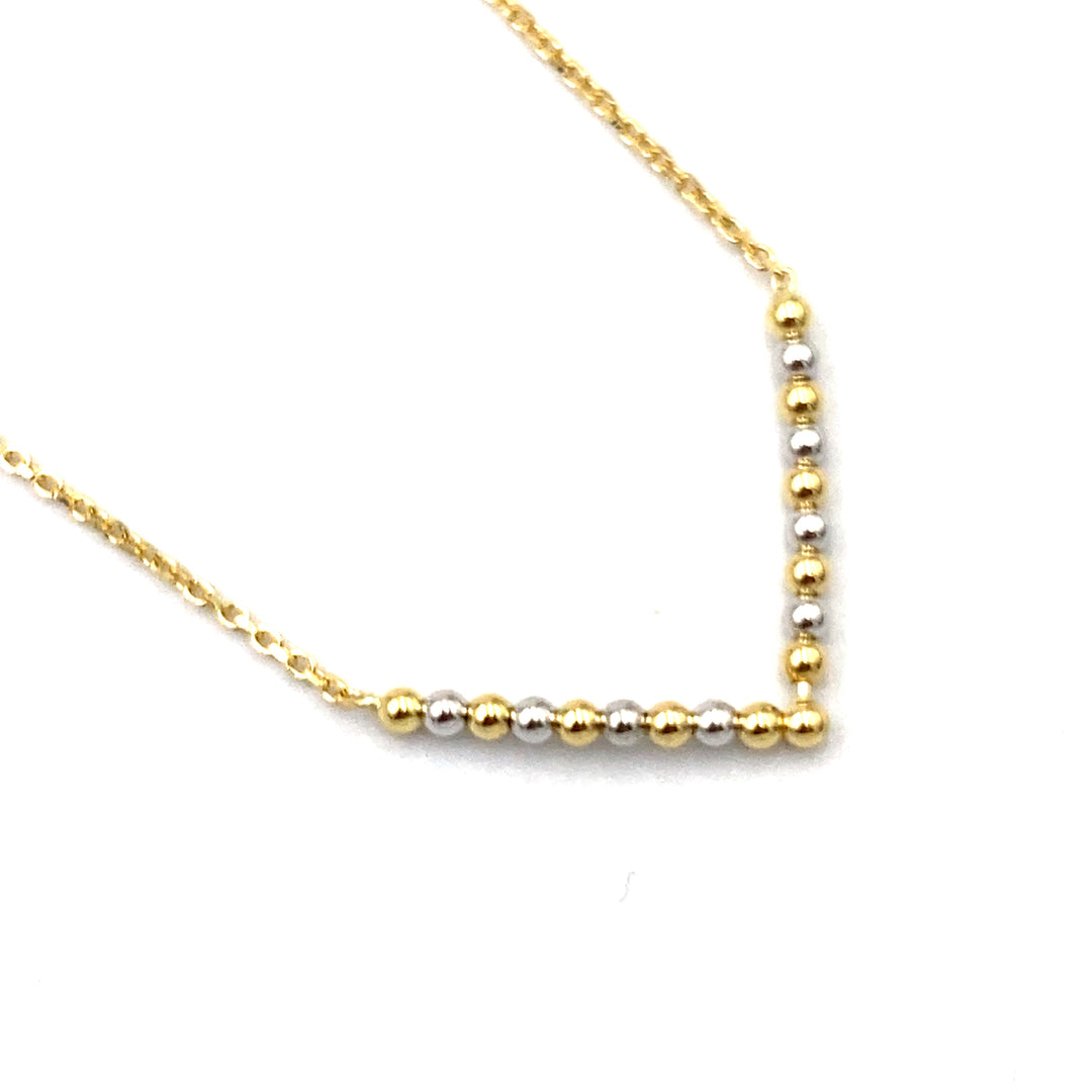 collana in oro bicolore con palline a forma di v siciliano gioielli