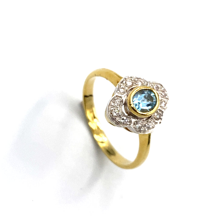 anello oro giallo con zirconi e topazio azzurro siciliano gioielli