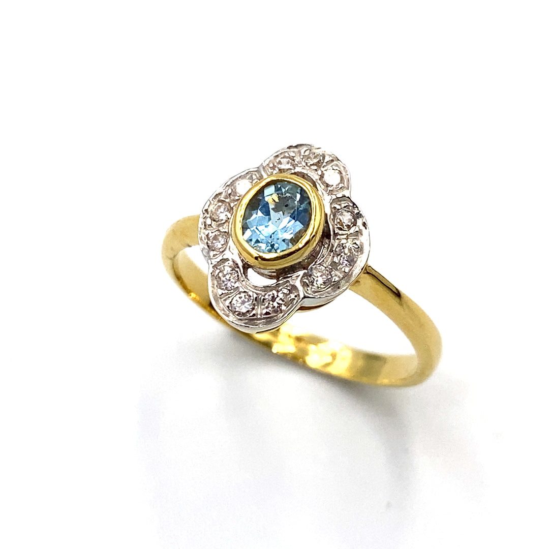 anello oro giallo con zirconi e topazio azzurro siciliano gioielli