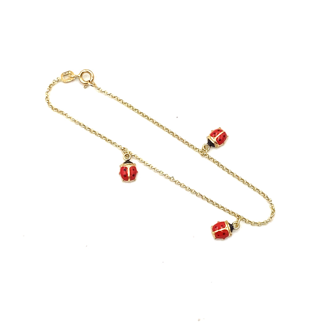 bracciale in oro giallo con coccinelle smaltate siciliano gioielli