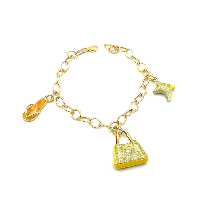 bracciale in oro giallo con charms siciliano gioielli