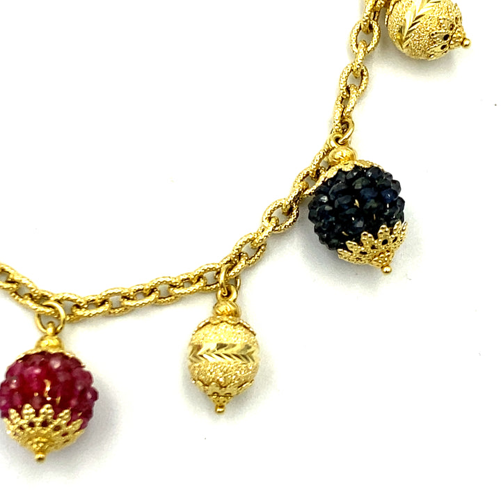 bracciale sun day oro giallo con zaffiri rubini e smeraldi - siciliano gioielli