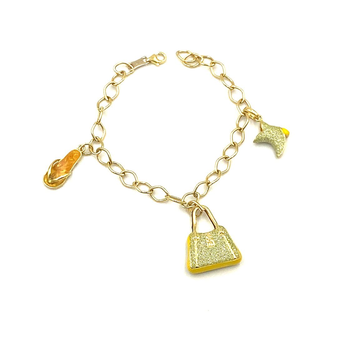 bracciale in oro giallo  con charms siciliano  gioielli 