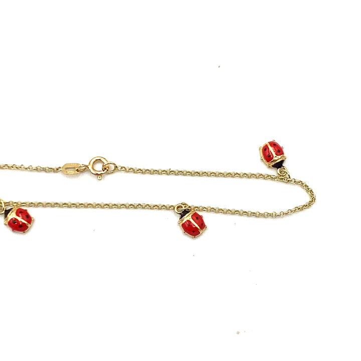 bracciale in oro giallo con coccinelle smaltate siciliano gioielli